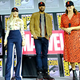 Cate Shortland (in orange dress) and (some of) the cast of Black Widow at the 2019 San Diego Comic-Con.